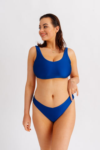 Horní díl plavek jednoduchého střihu bez vyztužení, s výstřihem do V, modrý