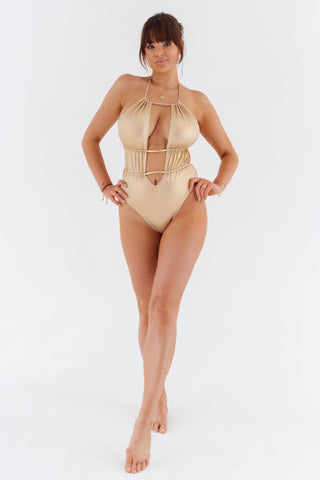 Jednodílné plavky monokiny s prostřihy a sponami, zlaté